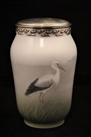 Vase from Royal Copenhagen (1898-1923) height: 18cm.
with motif of stork as well as silver edge and lid.