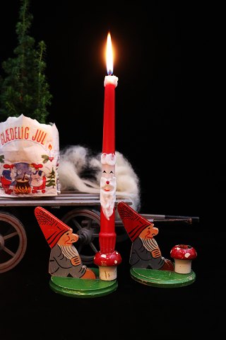 Old Swedish wooden Christmas candle holder with Santa Claus sitting with a red 
mushroom holding 1 candle...