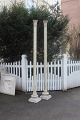 A pair of Antique French columns of wood with top decorated in stucco and base 
in granite. H:270cm.