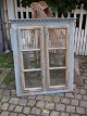 Decorative, old Swedish 1800 century window frame and with a very fine patina 
and remains of old blue color.
H:108cm. B:90cm.