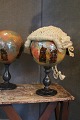 Antique French decorated glass ball 
on black wooden base.
(wig stand)
