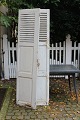 A pair of decorative old French shutters with white color and good patina.