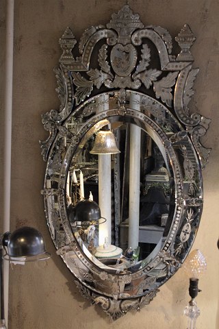 Very beautiful Venetian mirror from the 1920s with, decorated facet-cut mirror 
glass frame. H:145cm. B:80cm.
