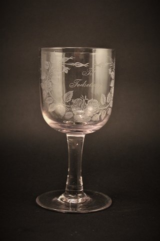 Old commemorative glass from Holmegaard glassworks with fine engraved floral 
decorations and writing "For Birthday" H:16cm. Dia:7.5cm.