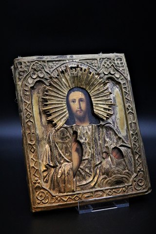 Old Greek Icon painted on wood with mounted Riza of brass with a really nice patina. 22x18cm.