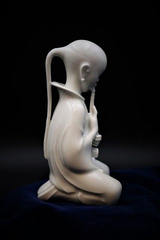 Royal Copenhagen porcelain figure in Blanc de Chine by opium smoker, design Arno 
Malinowski 
(1899-1976)
RC#2342. Height:14cm.