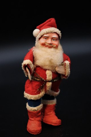 Old Santa Claus in sleeves and felt clothes. Height:14cm.