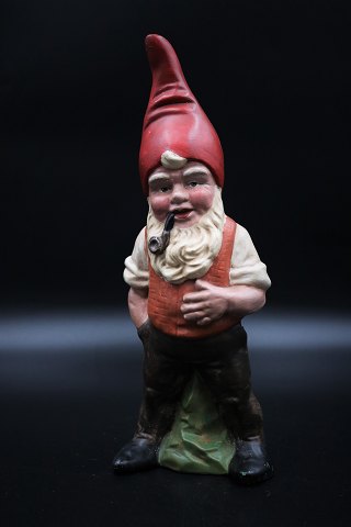 Painted terracotta pixie with pipe. Height: 30,5 cm.