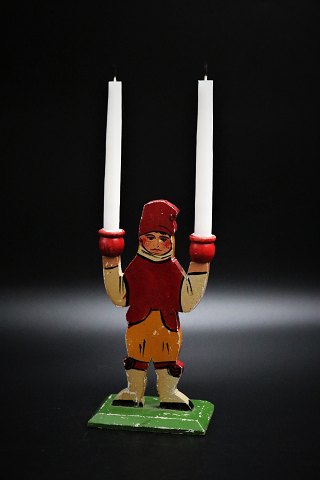 Old Swedish painted Christmas candlestick in the shape of little Santa boy 
carrying 2 small Christmas candles. H:16cm.