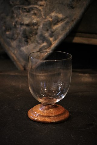 Old Swedish drinking glass fitted with wooden base....