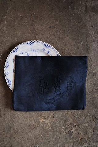 10 pcs. beautiful old French damask woven linen napkins with monogram and floral motifs in fine dark blue color. 87x68cm.
