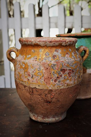Decorative 19th century clay jug with handle from the South of France with 
remnants of yellow ocher glaze...