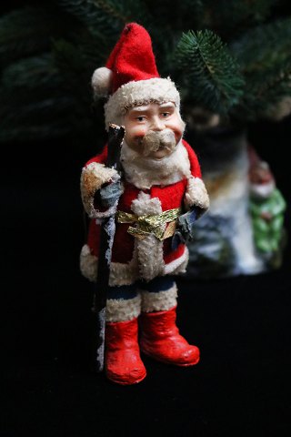 Nice, old Santa Claus from the 40s / 50s in felt clothes with small red boots 
and a stick...