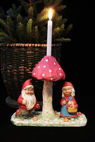 Old Christmas decoration in the form of a pair of elves standing under a 
mushroom...