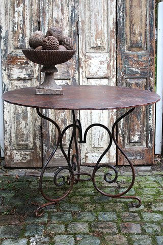 Old French round cafe iron table in polished wrought iron...