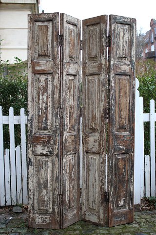 Room divider made of old French shutters with a really nice patina...