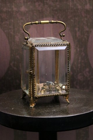 Antique French jewelry box in bronze with small angels, faceted glass and silk 
cushion at the bottom...