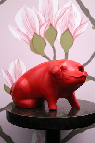 Decorative, old piggy bank in red painted terracotta from the 40s 
with a fine patina...