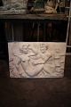 Decorative stoneware wall relief from the 30s with sensual motif of woman & Pan figure. 42x64cm.