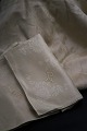 Beautiful old French champagne colored damask woven linen napkins + tablecloth with monogram and floral motifs. 16 pcs. 65x65cm.Cloth: 5x2 meters