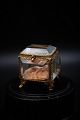Old French jewelry box in bronze and faceted glass, silk pillow and a nice old patina. H:6,5cm. L&W:6,5x5,5cm.