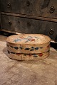 Swedish 1800 century oval wooden box with original paint with floral motif.H:20cm. L&W:42x26cm.