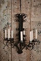 Old raw French metal chandelier with a super patina and with room for 8 candles...