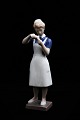 Bing & Grondahl porcelain figure of a nurse.RC#2379. 1.sort.Height: 23cm.