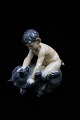 Royal Copenhagen porcelæns figur af Pan figur siddende på bjørn.DJ#648. 2.sort. Højde: 15,5cm.