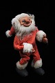 Gammel julenisse med rødt filttøj , gummi ansigt med glas øjne…