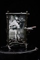 Old photo frame in metal, finely decorated frame in the form of branches and a 
small bird...