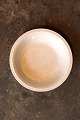 Old Swedish cream-colored earthenware bowl with pearl edge and a fine patina...