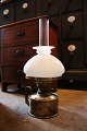 Old kerosene lamp in brass with white opal glass lampshade...