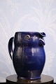 "Lillerød" owl jug in glazed earthenware in fine dark blue glaze. 
Height: 17.5 cm...
