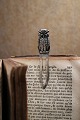 Old bookmark in the shape of an owl in silver with green eyes...