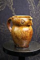 "Lillerod" owl jug in glazed earthenware in fine ocher yellow / brown chipped 
glaze...