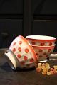 Old cafe latte bowl in earthenware with orange dots and a super fine patina...