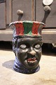 Antique terracotta flower pot 
in the shape of the head of a black African woman...