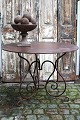 Old French round cafe iron table in polished wrought iron...