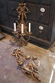 A pair of antique wall candlesticks in carved wood with old silver paint and 
each with 3 candle holders in metal...