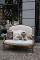 Empire salon sofa , forgyldt med fin gammel patina og betrukket med lyst 
hørstof...
